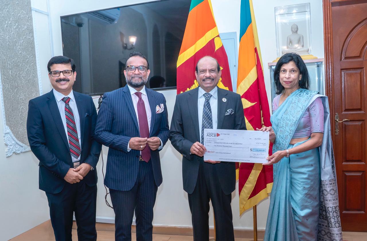 Yusuffali M.A hands over the cheque to Arusha Cooray, Ambassador of Sri Lanka to UAE